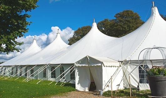 a line of sleek and modern portable restrooms ready for use at an upscale corporate event in Wilder